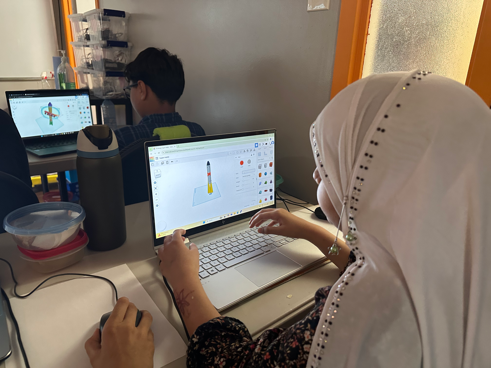 Students working on coding projects